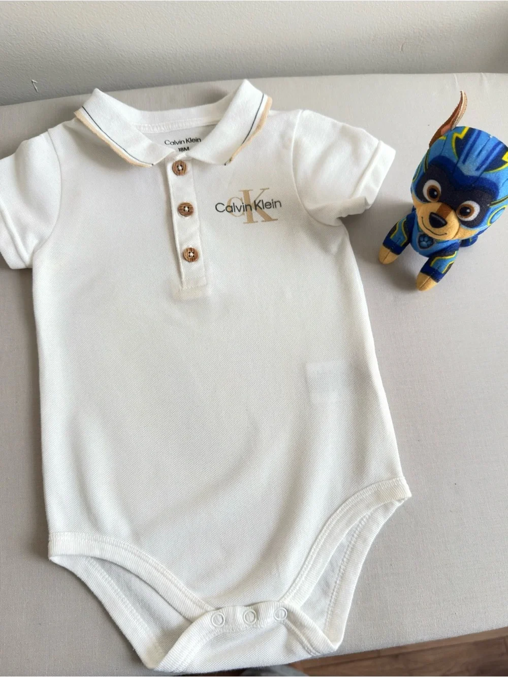 Calvin Klein White Polo Bodysuit with Gold Logo,size 12-18 months.